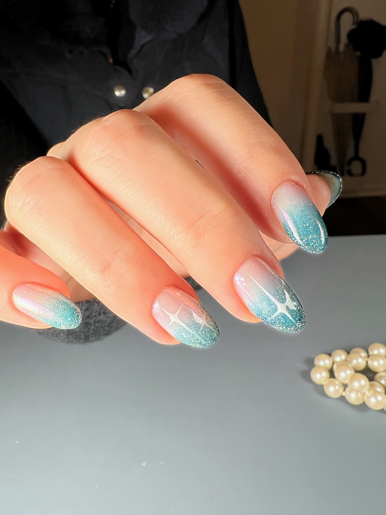 Bold aqua star nail art detail